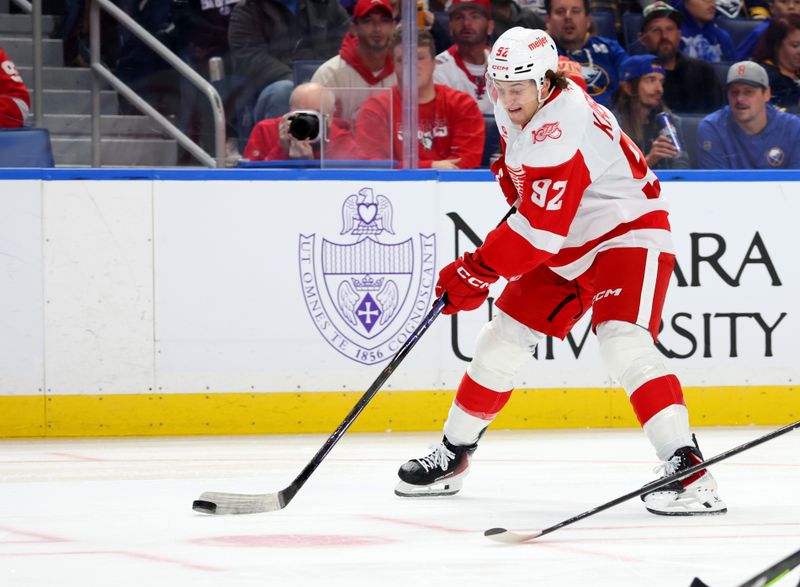 Oct 22, 2025; Buffalo, New York, USA;  Detroit Red Wings center Marco Kasper (92) takes a shot on goal during the first period against the Buffalo Sabres at KeyBank Center. Mandatory Credit: Timothy T. Ludwig-Imagn Images
