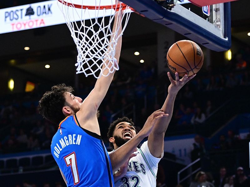 OKLAHOMA CITY, OKLAHOMA - JANUARY 29: Karl-Anthony Towns #32 of the Minnesota Timberwolves puts up a shot around Chet Holmgren #7 of the Oklahoma City Thunder during the second half at Paycom Center on January 29, 2024 in Oklahoma City, Oklahoma. NOTE TO USER: User expressly acknowledges and agrees that, by downloading and or using this Photograph, user is consenting to the terms and conditions of the Getty Images License Agreement. (Photo by Joshua Gateley/Getty Images)