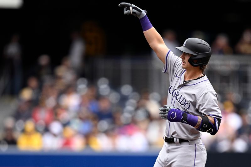 May 15, 2024; San Diego, California, USA; Colorado Rockies left fielder Jordan Beck (27) celebrates after hitting a two-RBI double against the San Diego Padres during the second inning at Petco Park. Mandatory Credit: Orlando Ramirez-USA TODAY Sports