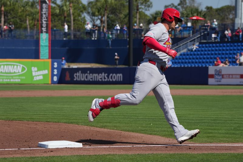 Feb 25, 2026; Port St. Lucie, Florida, USA;  St. Louis Cardinals second baseman Nolan Gorman (16) rounds third base after hitting a three-run home run against the New York Mets in the third inning at Clover Park. Mandatory Credit: Jim Rassol-Imagn Images