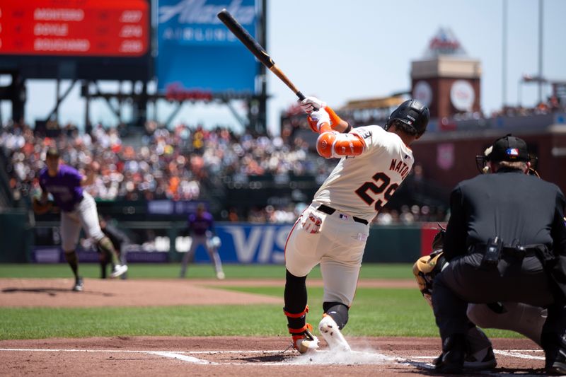 May 18, 2024; San Francisco, California, USA; San Francisco Giants center fielder Luis Matos (29) connects for a three-run home run off Colorado Rockies starting pitcher Ty Blach (50) during the first inning at Oracle Park. Mandatory Credit: D. Ross Cameron-USA TODAY Sports