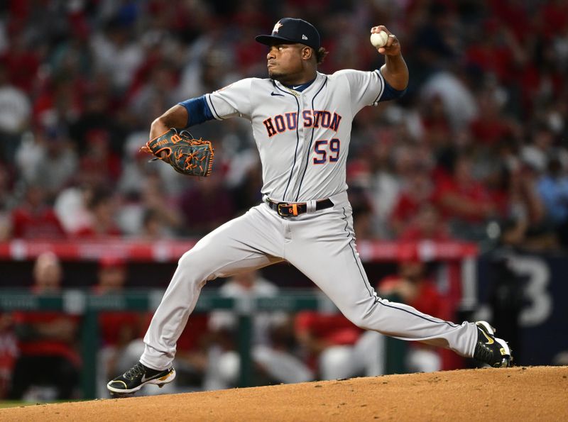 Apr 7, 2022; Anaheim, California, USA; Houston Astros starting pitcher Framber Valdez (59) throws a pitch in the second inning against the Los Angeles Angels at Angel Stadium. Mandatory Credit: Jayne Kamin-Oncea-USA TODAY Sports