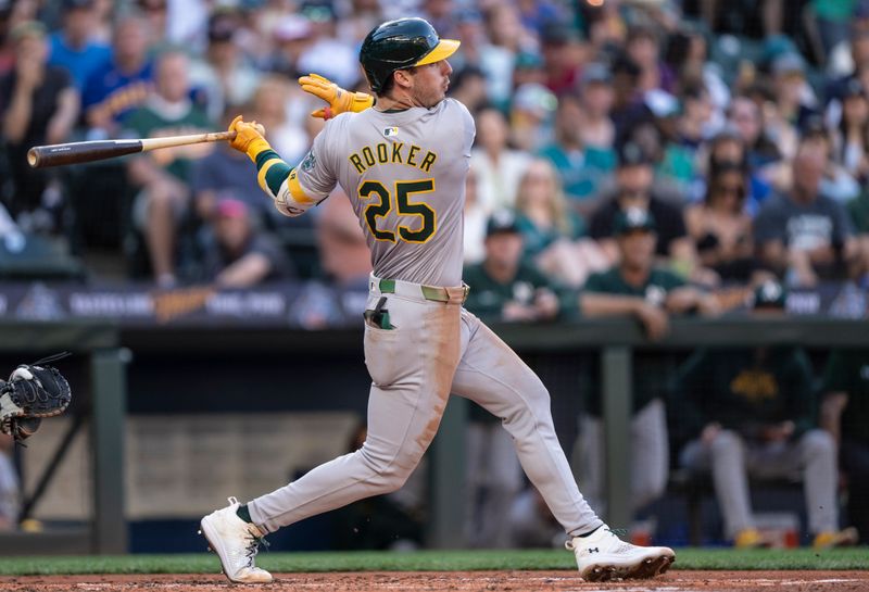 May 11, 2024; Seattle, Washington, USA; Oakland Athletics designated hitter Brent Rooker (25) hits a RBI-single during the third inning against the Seattle Mariners at T-Mobile Park. Mandatory Credit: Stephen Brashear-USA TODAY Sports