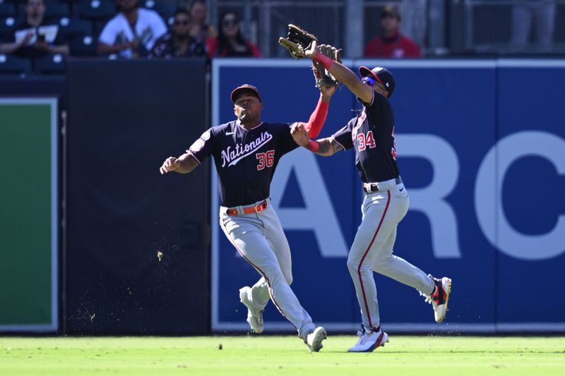 Jun 25, 2023; San Diego, California, USA; Washington Nationals center fielder Derek Hill (34) makes a game-ending catch before colliding with left fielder Stone Garrett (36) in the ninth inning against the San Diego Padres at Petco Park. Mandatory Credit: Orlando Ramirez-USA TODAY Sports