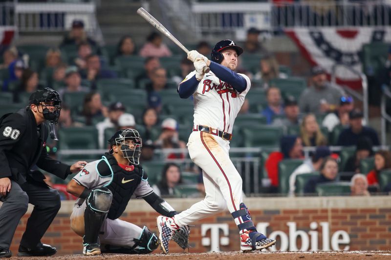 Apr 6, 2024; Atlanta, Georgia, USA; Atlanta Braves left fielder Jarred Kelenic (24) hits a double against the Arizona Diamondbacks in the eighth inning at Truist Park. Mandatory Credit: Brett Davis-USA TODAY Sports
