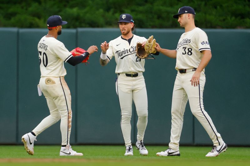 Jun 26, 2025; Minneapolis, Minnesota, USA; Minnesota Twins left fielder Willi Castro (50)  center fielder DaShawn Keirsey (21) and right fielder Matt Wallner (38) celebrate the win over the Seattle Mariners at Target Field. Mandatory Credit: Bruce Kluckhohn-Imagn Images