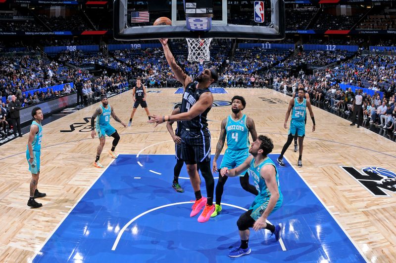 ORLANDO, FL - MARCH 19: Jalen Suggs #4 of the Orlando Magic drives to the basket during the game against the Charlotte Hornets on March 19, 2024 at the Kia Center in Orlando, Florida. NOTE TO USER: User expressly acknowledges and agrees that, by downloading and or using this photograph, User is consenting to the terms and conditions of the Getty Images License Agreement. Mandatory Copyright Notice: Copyright 2024 NBAE (Photo by Fernando Medina/NBAE via Getty Images)