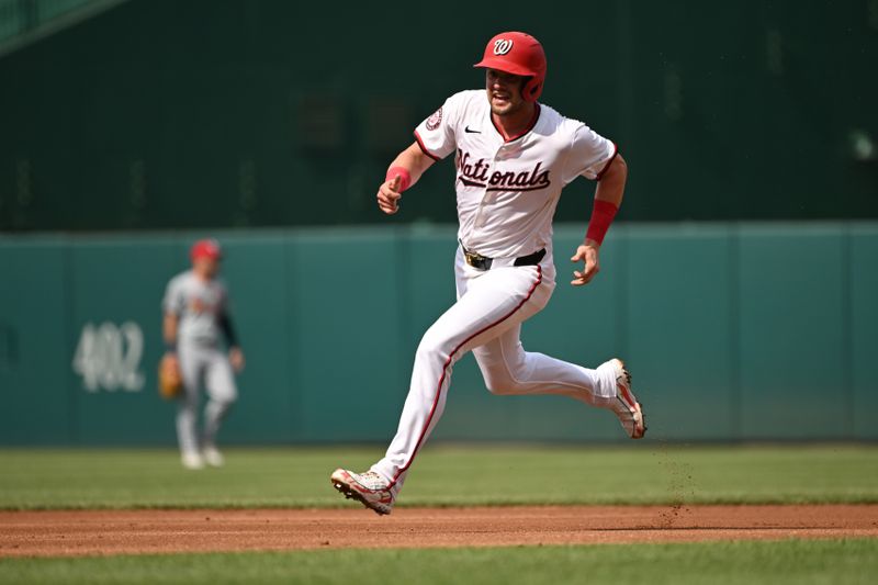 Jul 8, 2024; Washington, District of Columbia, USA; Washington Nationals right fielder Lane Thomas (28) sprints to third base against the St. Louis Cardinals during the first inning at Nationals Park. Mandatory Credit: Rafael Suanes-USA TODAY Sports