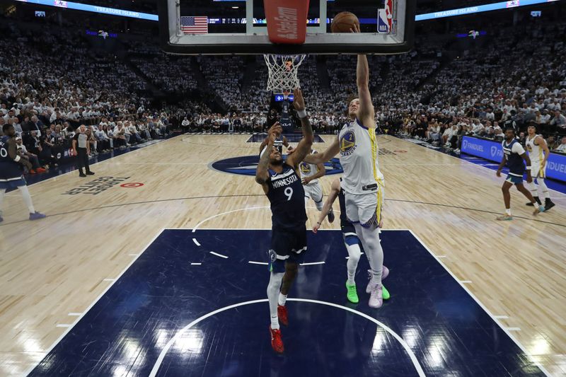 MINNEAPOLIS, MN -  MAY 8:  Brandin Podziemski #2 of the Golden State Warriors drives to the basket during the game against the Minnesota Timberwolves  during Round 2 Game 2 of the 2025 NBA Playoffs on May 8, 2025 at Target Center in Minneapolis, Minnesota. NOTE TO USER: User expressly acknowledges and agrees that, by downloading and or using this Photograph, user is consenting to the terms and conditions of the Getty Images License Agreement. Mandatory Copyright Notice: Copyright 2025 NBAE (Photo by Jordan Johnson/NBAE via Getty Images)