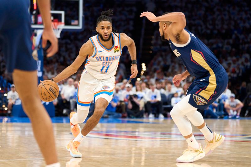 OKLAHOMA CITY, OKLAHOMA - APRIL 21: Isaiah Joe #11 of the Oklahoma City Thunder drives to the basket against the New Orleans Pelicans in game one of the Western Conference First Round Playoffs at the Paycom Center on April 21, 2024 in Oklahoma City, Oklahoma. NOTE TO USER: User expressly acknowledges and agrees that, by downloading and or using this photograph, User is consenting to the terms and conditions of the Getty Images License Agreement.  (Photo by Cooper Neill/Getty Images)