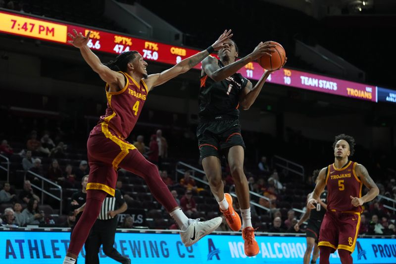 Dec 17, 2025; Los Angeles, California, USA; UTSA Roadrunners forward Kaidon Rayfield (1) shoots the ball against Southern California Trojans forward Chad Baker-Mazara (4) in the first half at Galen Center. Mandatory Credit: Kirby Lee-Imagn Images