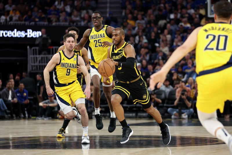 SAN FRANCISCO, CALIFORNIA - MARCH 22: Chris Paul #3 of the Golden State Warriors dribbles down court against T.J. McConnell #9 of the Indiana Pacers in the first half at Chase Center on March 22, 2024 in San Francisco, California. NOTE TO USER: User expressly acknowledges and agrees that, by downloading and or using this photograph, User is consenting to the terms and conditions of the Getty Images License Agreement.  (Photo by Ezra Shaw/Getty Images)