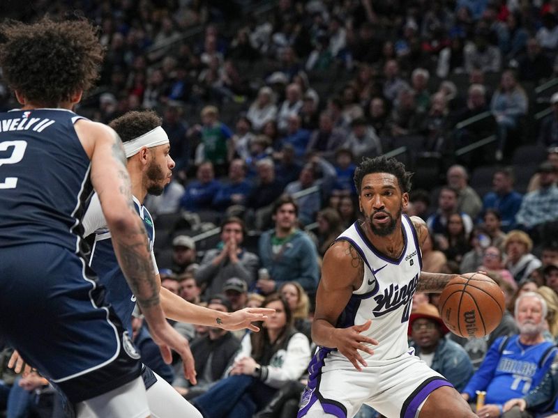 DALLAS, TX - JANUARY 27: Malik Monk #0 of the Sacramento Kings handles the ball during the game  on January 27, 2024 at the American Airlines Center in Dallas, Texas. NOTE TO USER: User expressly acknowledges and agrees that, by downloading and or using this photograph, User is consenting to the terms and conditions of the Getty Images License Agreement. Mandatory Copyright Notice: Copyright 2024 NBAE (Photo by Glenn James/NBAE via Getty Images)