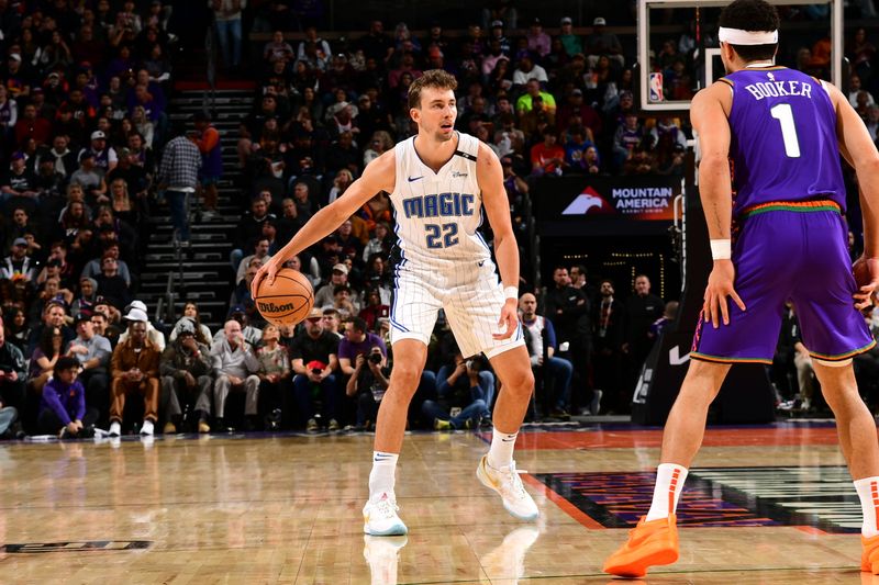 PHOENIX, AZ - NOVEMBER 18: Franz Wagner #22 of the Orlando Magic looks on during the game against the Phoenix Suns on November 18, 2024 at Footprint Center in Phoenix, Arizona. NOTE TO USER: User expressly acknowledges and agrees that, by downloading and or using this photograph, user is consenting to the terms and conditions of the Getty Images License Agreement. Mandatory Copyright Notice: Copyright 2024 NBAE (Photo by Kate Frese/NBAE via Getty Images)