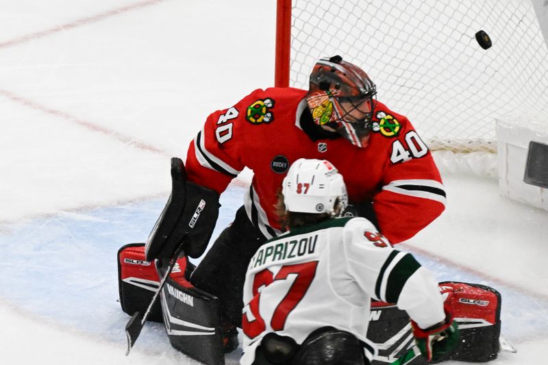 Apr 7, 2024; Chicago, Illinois, USA;  Minnesota Wild left wing Kirill Kaprizov (97) scored a goal Chicago Blackhawks goaltender Arvid Soderblom (40) during the third period at United Center. Mandatory Credit: Matt Marton-USA TODAY Sports