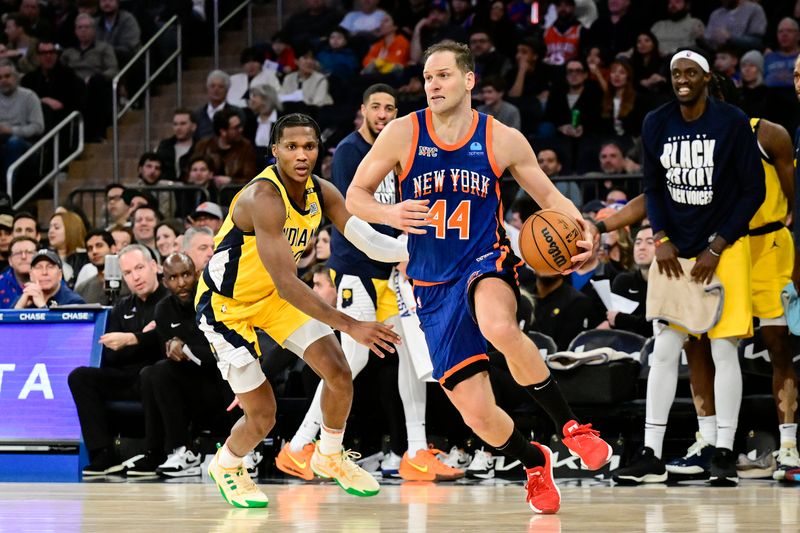 NEW YORK, NEW YORK - FEBRUARY 10:  Bojan Bogdanovic #44 of the New York Knicks drives to the basket past Bennedict Mathurin #00 of the Indiana Pacers during the second half at Madison Square Garden on February 10, 2024 in New York City. NOTE TO USER: User expressly acknowledges and agrees that, by downloading and or using this photograph, User is consenting to the terms and conditions of the Getty Images License Agreement. (Photo by Steven Ryan/Getty Images)