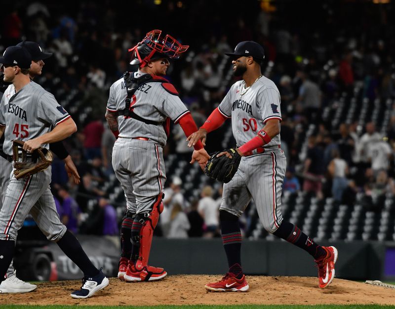 Sep 30, 2023; Denver, Colorado, USA; Minnesota Twins catcher Christian Vazquez (8) and Minnesota Twins shortstop Willi Castro (50) slap hands after the win over the Colorado Rockies at Coors Field. Mandatory Credit: John Leyba-USA TODAY Sports