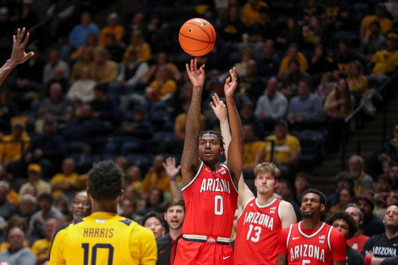 Jan 7, 2025; Morgantown, West Virginia, USA; Arizona Wildcats guard Jaden Bradley (0) shoots a three pointer during the second half against the West Virginia Mountaineers at WVU Coliseum. Mandatory Credit: Ben Queen-Imagn Images
