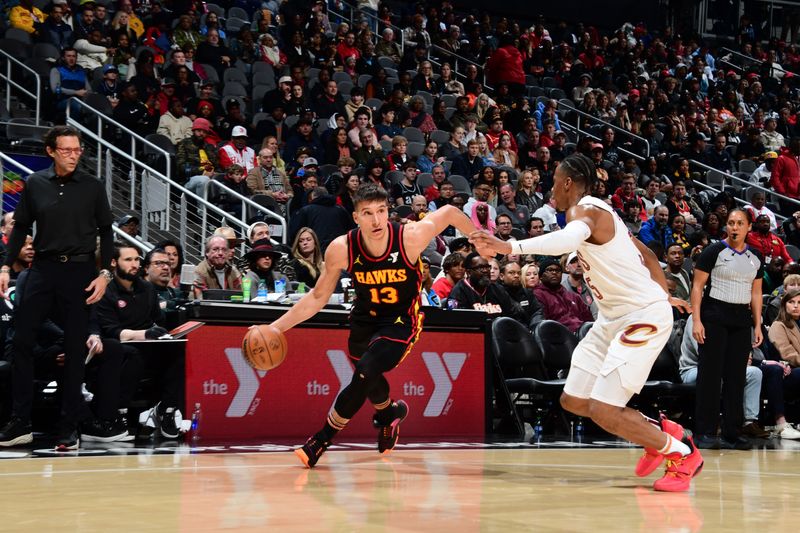 ATLANTA, GA - JANUARY 20: Bogdan Bogdanovic #13 of the Atlanta Hawks drives to the basket during the game against the Cleveland Cavaliers on January 20, 2024 at State Farm Arena in Atlanta, Georgia.  NOTE TO USER: User expressly acknowledges and agrees that, by downloading and/or using this Photograph, user is consenting to the terms and conditions of the Getty Images License Agreement. Mandatory Copyright Notice: Copyright 2024 NBAE (Photo by Scott Cunningham/NBAE via Getty Images)