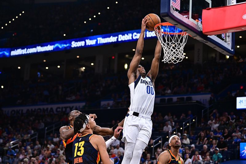 OKLAHOMA CITY, OKLAHOMA - APRIL 14: Brandon Williams #00 of the Dallas Mavericks goes up for a dunk during the second half against the Oklahoma City Thunder at Paycom Center on April 14, 2024 in Oklahoma City, Oklahoma. NOTE TO USER: User expressly acknowledges and agrees that, by downloading and or using this Photograph, user is consenting to the terms and conditions of the Getty Images License Agreement. (Photo by Joshua Gateley/Getty Images)