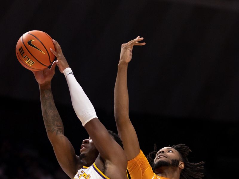 Jan 21, 2023; Baton Rouge, Louisiana, USA;  LSU Tigers forward KJ Williams (12) and Tennessee Volunteers forward Jonas Aidoo (0) battle for a rebound during the second half at Pete Maravich Assembly Center. Mandatory Credit: Stephen Lew-USA TODAY Sports