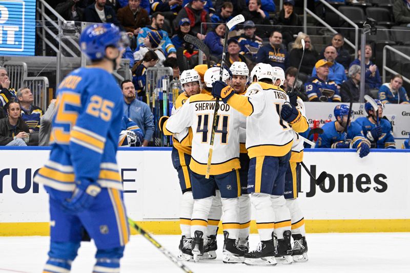 Feb 17, 2024; St. Louis, Missouri, USA; Nashville Predators defenseman Luke Schenn (2) is congratulated by teammates after scoring a goal against the St. Louis Blues during the third period at Enterprise Center. Mandatory Credit: Jeff Le-USA TODAY Sports