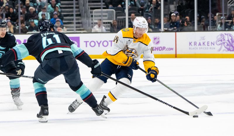 Nov 20, 2024; Seattle, Washington, USA;  Nashville Predators forward Gustav Nyquist (14) skates against Seattle Kraken defenseman Ryker Evans (41) during the third period at Climate Pledge Arena. Mandatory Credit: Stephen Brashear-Imagn Images