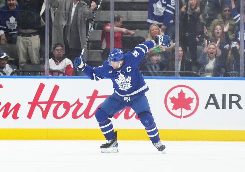 Apr 13, 2024; Toronto, Ontario, CAN; Toronto Maple Leafs center John Tavares (91) celebrates scoring a goal against the Detroit Red Wings during the second period at Scotiabank Arena. Mandatory Credit: Nick Turchiaro-USA TODAY Sports