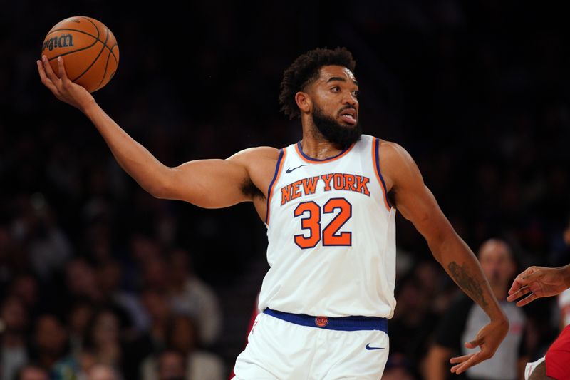 NEW YORK, NEW YORK - OCTOBER 09: Karl-Anthony Towns #32 of the New York Knicks handles the ball against the Washington Wizards during the second half of a preseason game at Madison Square Garden on October 09, 2024 in New York City. NOTE TO USER: User expressly acknowledges and agrees that, by downloading and or using this Photograph, user is consenting to the terms and conditions of the Getty Images License Agreement. (Photo by Evan Bernstein/Getty Images)