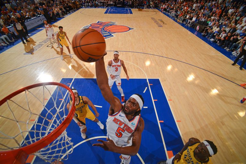 NEW YORK, NY - MAY 19: Precious Achiuwa #5 of the New York Knicks dunks the ball during the game against the Indiana Pacers during Round 2 Game 7 of the 2024 NBA Playoffs on May 19, 2024 at Madison Square Garden in New York City, New York.  NOTE TO USER: User expressly acknowledges and agrees that, by downloading and or using this photograph, User is consenting to the terms and conditions of the Getty Images License Agreement. Mandatory Copyright Notice: Copyright 2024 NBAE  (Photo by Jesse D. Garrabrant/NBAE via Getty Images)