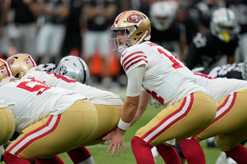 San Francisco 49ers quarterback Sam Darnold (14) plays against the Las Vegas Raiders during an NFL football game, Sunday, Aug. 13, 2023, in Las Vegas. (AP Photo/John Locher)