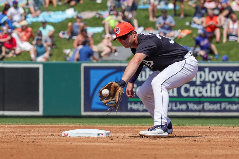 Mar 21, 2024; Lakeland, Florida, USA; Detroit Tigers second baseman Colt Keith (33) fields a ball during the third inning against the New York Mets at Publix Field at Joker Marchant Stadium. Mandatory Credit: Mike Watters-USA TODAY Sports