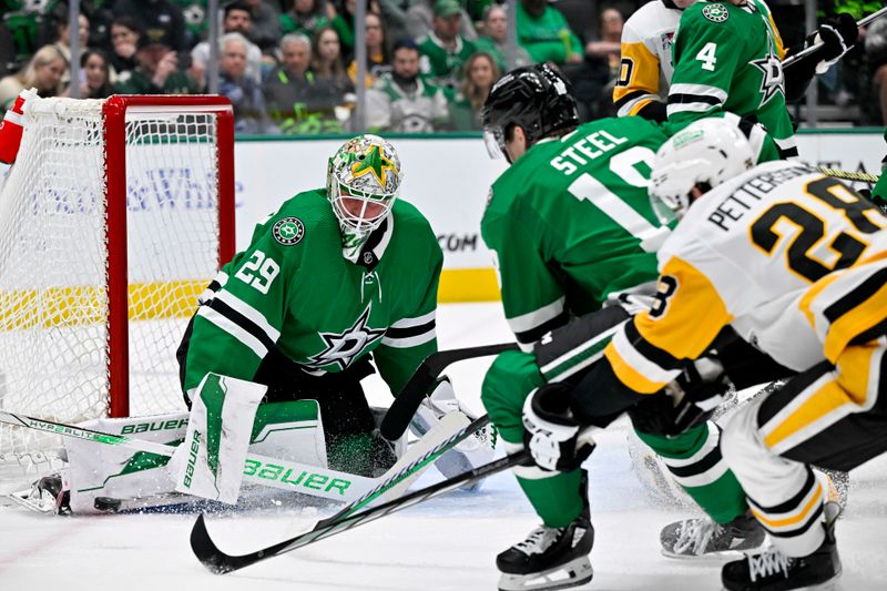 Mar 22, 2024; Dallas, Texas, USA; Dallas Stars goaltender Jake Oettinger (29) stops a shot by Pittsburgh Penguins defenseman Marcus Pettersson (28) during the first period at the American Airlines Center. Mandatory Credit: Jerome Miron-USA TODAY Sports