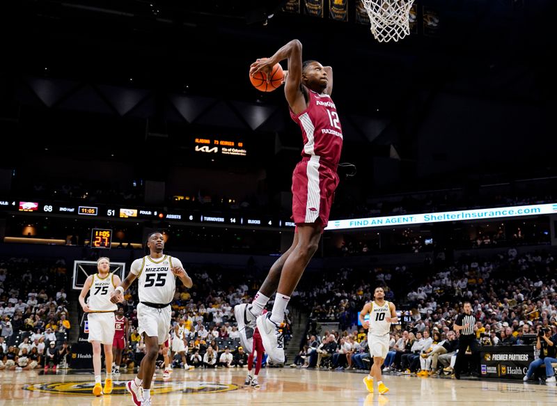 Jan 31, 2024; Columbia, Missouri, USA; Arkansas Razorbacks guard Tramon Mark (12) dunks the ball against the Missouri Tigers during the second half at Mizzou Arena. Mandatory Credit: Jay Biggerstaff-USA TODAY Sports