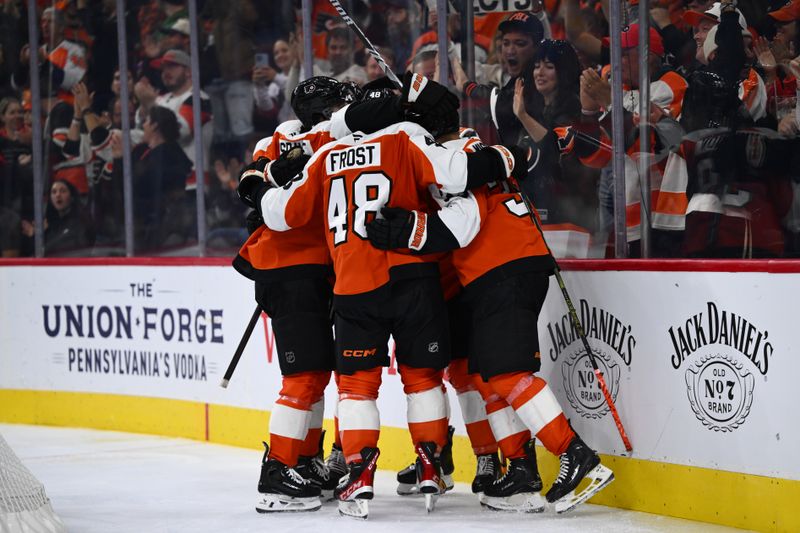 Oct 26, 2024; Philadelphia, Pennsylvania, USA; The Philadelphia Flyers celebrate after a goal from right wing Travis Konecny (11) against the Minnesota Wild in the third period at Wells Fargo Center. Mandatory Credit: Kyle Ross-Imagn Images