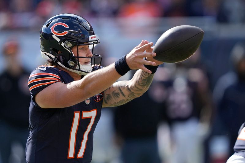 Chicago Bears quarterback Tyson Bagent takes the snap from center in the shotgun formation during an NFL football game against the Minnesota Vikings on Sunday, Oct. 15, 2023, in Chicago. (AP Photo/Charles Rex Arbogast)