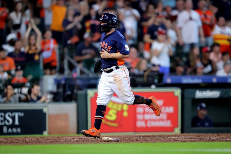 Jul 30, 2023; Houston, Texas, USA; Houston Astros second baseman Jose Altuve (27) scores a run against the Tampa Bay Rays during the fifth inning at Minute Maid Park. Mandatory Credit: Erik Williams-USA TODAY Sports