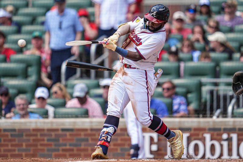 Apr 23, 2025; Cumberland, Georgia, USA; Atlanta Braves outfielder Michael Harris II (23) breaks his bat while hitting a single against the St. Louis Cardinals during the fifth inning at Truist Park. Mandatory Credit: Dale Zanine-Imagn Images