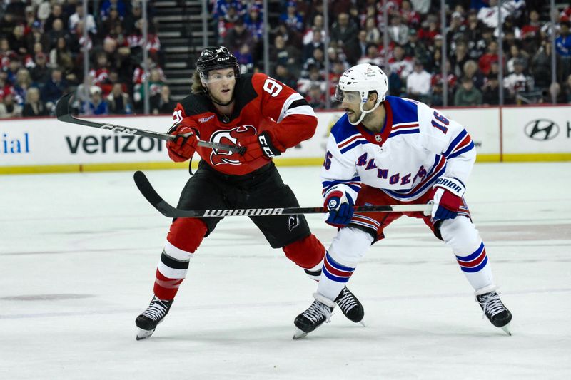 Feb 22, 2024; Newark, New Jersey, USA; New Jersey Devils center Dawson Mercer (91) braces for a check against New York Rangers center Vincent Trocheck (16) during the second period at Prudential Center. Mandatory Credit: John Jones-USA TODAY Sports