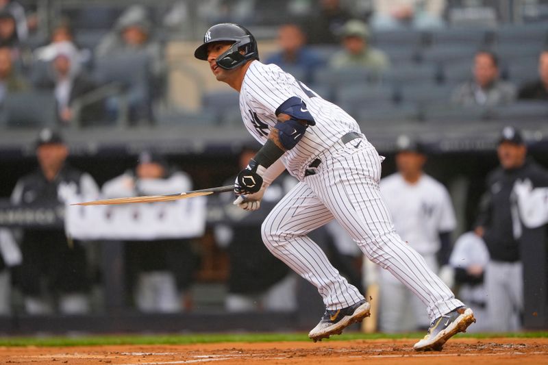 Apr 5, 2023; Bronx, New York, USA; New York Yankees designated hitter Gleybor Torres (25) hits an RBI single against the Philadelphia Phillies during the first inning at Yankee Stadium. Mandatory Credit: Gregory Fisher-USA TODAY Sports