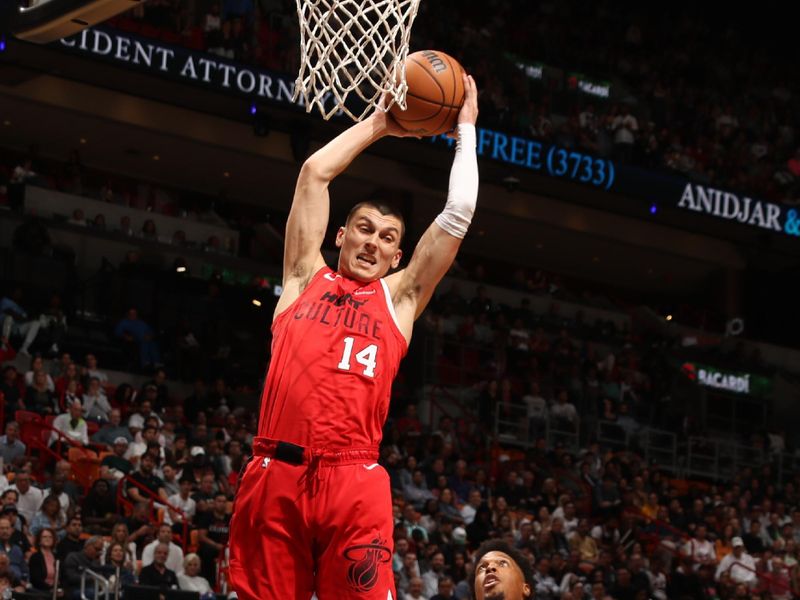 MIAMI, FL - NOVEMBER 18: Tyler Herro #14 of the Miami Heat grabs the rebound during the game against the Philadelphia 76ers on November 18, 2024 at Kaseya Center in Miami, Florida. NOTE TO USER: User expressly acknowledges and agrees that, by downloading and or using this Photograph, user is consenting to the terms and conditions of the Getty Images License Agreement. Mandatory Copyright Notice: Copyright 2024 NBAE (Photo by Issac Baldizon/NBAE via Getty Images)