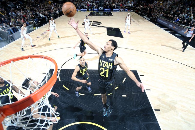 SALT LAKE CITY, UT - APRIL 9: Darius Bazley #21 of the Utah Jazz grabs the rebound during the game against the Denver Nuggets on April 9, 2024 at Delta Center in Salt Lake City, Utah. NOTE TO USER: User expressly acknowledges and agrees that, by downloading and or using this Photograph, User is consenting to the terms and conditions of the Getty Images License Agreement. Mandatory Copyright Notice: Copyright 2024 NBAE (Photo by Melissa Majchrzak/NBAE via Getty Images)