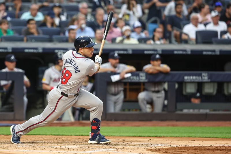 Jun 21, 2024; Bronx, New York, USA; Atlanta Braves right fielder Ramón Laureano (18) hits an RBI single in the third inning against the New York Yankees at Yankee Stadium. Mandatory Credit: Wendell Cruz-USA TODAY Sports