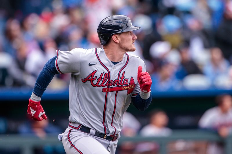 Apr 16, 2023; Kansas City, Missouri, USA; Atlanta Braves catcher Sean Murphy (12) heads to first base after a hit during the third inning against the Kansas City Royals at Kauffman Stadium. Mandatory Credit: William Purnell-USA TODAY Sports