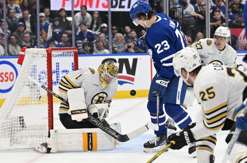 May 2, 2024; Toronto, Ontario, CAN;   Boston Bruins goalie Jeremy Swayman (1) makes a save in front of Toronto Maple Leafs forward Matthews Knies (23) in the first period in game six of the first round of the 2024 Stanley Cup Playoffs at Scotiabank Arena. Mandatory Credit: Dan Hamilton-USA TODAY Sports