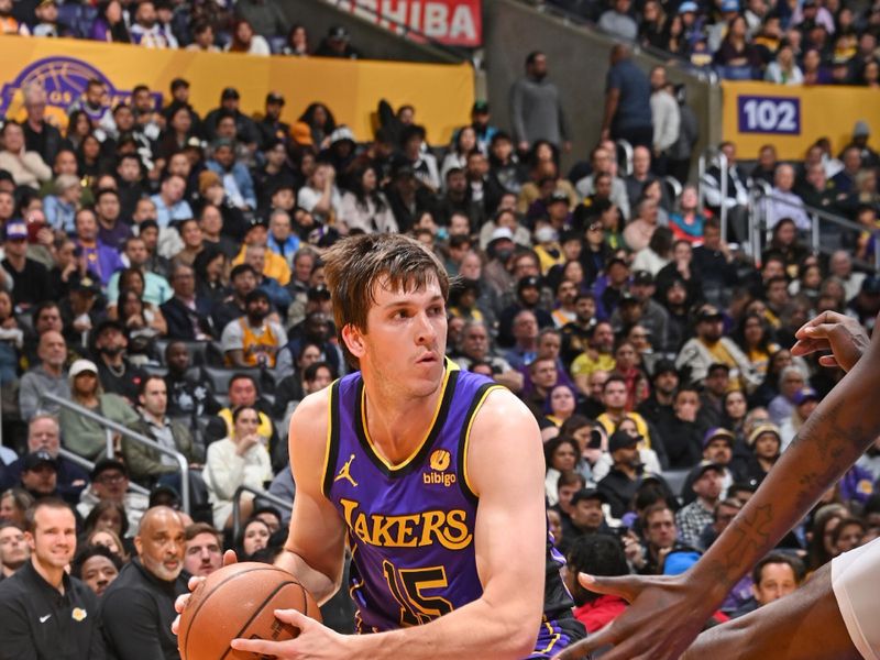 LOS ANGELES, CA - JANUARY 11: Austin Reaves #15 of the Los Angeles Lakers looks to pass the ball during the game against the Phoenix Suns on January 11, 2024 at Crypto.Com Arena in Los Angeles, California. NOTE TO USER: User expressly acknowledges and agrees that, by downloading and/or using this Photograph, user is consenting to the terms and conditions of the Getty Images License Agreement. Mandatory Copyright Notice: Copyright 2024 NBAE (Photo by Andrew D. Bernstein/NBAE via Getty Images)