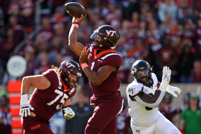 Oct 14, 2023; Blacksburg, Virginia, USA; Virginia Tech Hokies quarterback Kyron Drones (1) throws a pass during the first quarter against the Wake Forest Demon Deacons at Lane Stadium. Mandatory Credit: Peter Casey-USA TODAY Sports