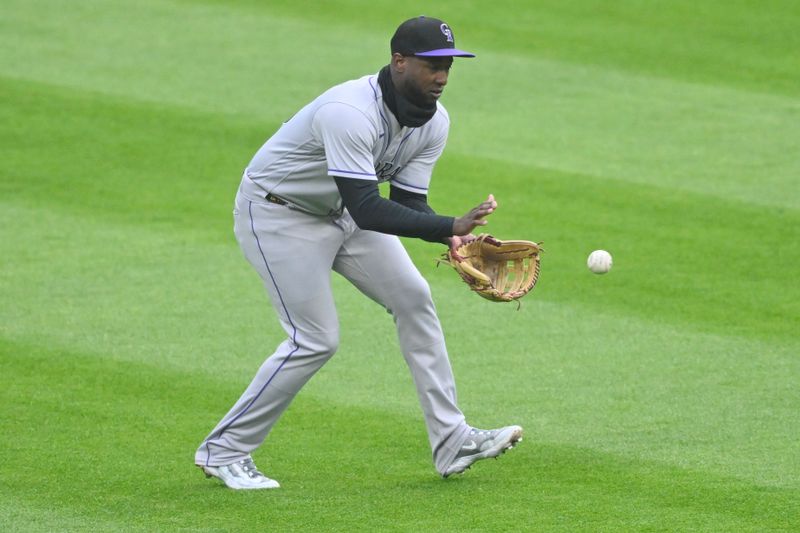 Apr 25, 2023; Cleveland, Ohio, USA; Colorado Rockies left fielder Jurickson Profar (29) fields the ball during the first inning against the Cleveland Guardians at Progressive Field. Mandatory Credit: David Richard-USA TODAY Sports