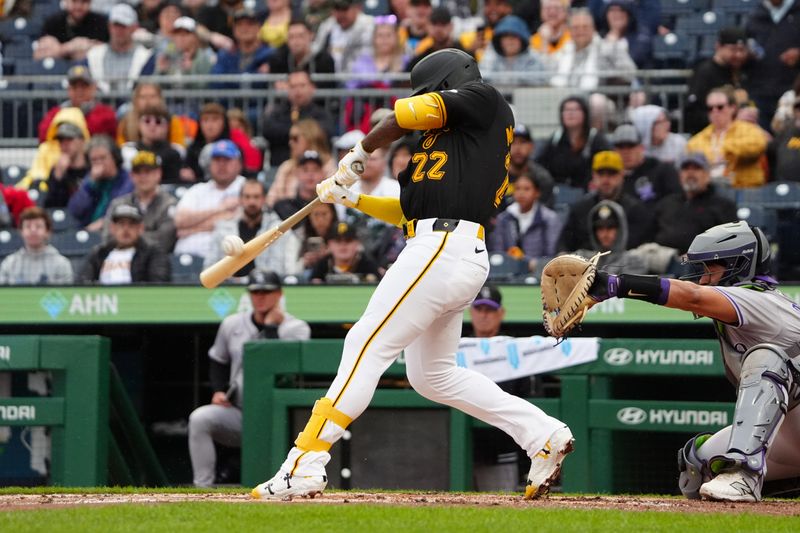 May 4, 2024; Pittsburgh, Pennsylvania, USA; Pittsburgh Pirates designated hitter Andrew McCutchen (22) hits a single against the Colorado Rockies during the third inning at PNC Park. Mandatory Credit: Gregory Fisher-USA TODAY Sports