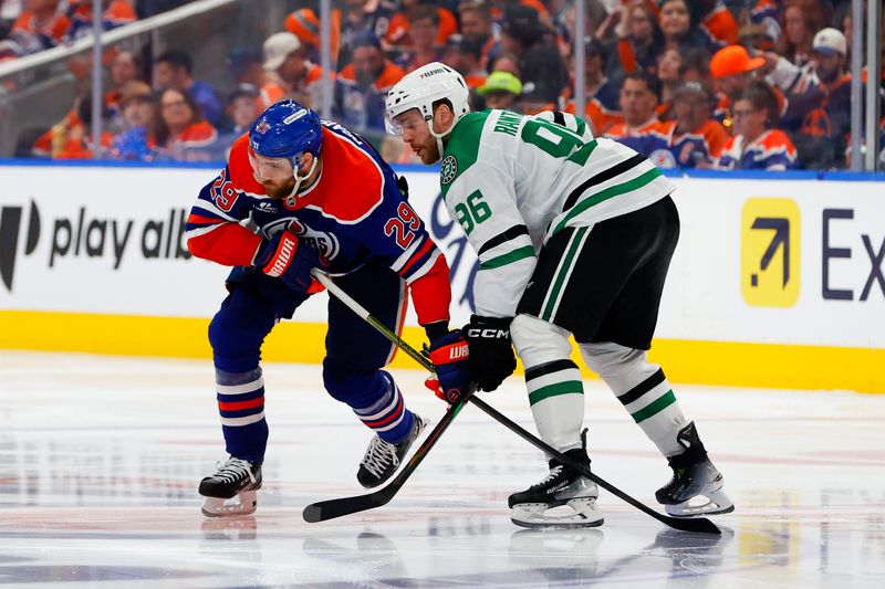 May 25, 2025; Edmonton, Alberta, CAN; Edmonton Oilers center Leon Draisaitl (29) and Dallas Stars right wing Mikko Rantanen (96) look for the puck during the third period in game three of the Western Conference Final of the 2025 Stanley Cup Playoffs at Rogers Place. Mandatory Credit: Perry Nelson-Imagn Images